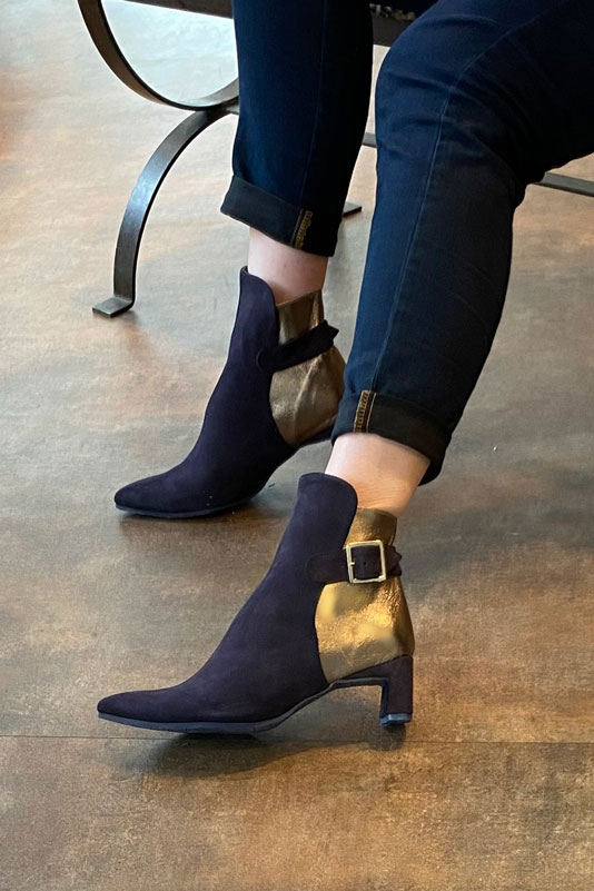 Navy blue and bronze gold women's ankle boots with buckles at the back. Tapered toe. Medium flare heels. Worn view - Florence KOOIJMAN
